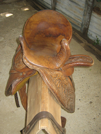 Image of a horse side saddle on a timber stand
